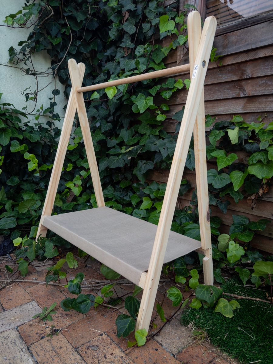 Toddler clothing rail with a fabric shelf